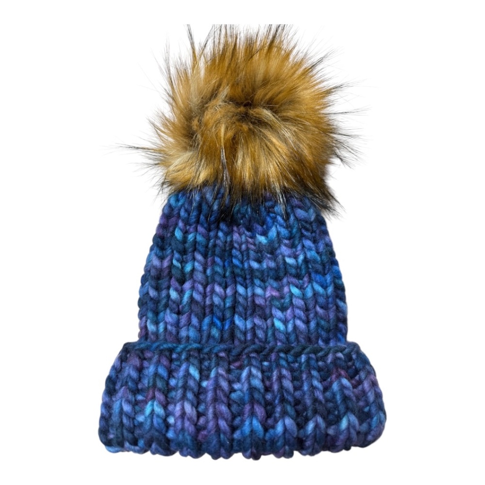 Hand knit blue varigated knit hat with faux fur pom